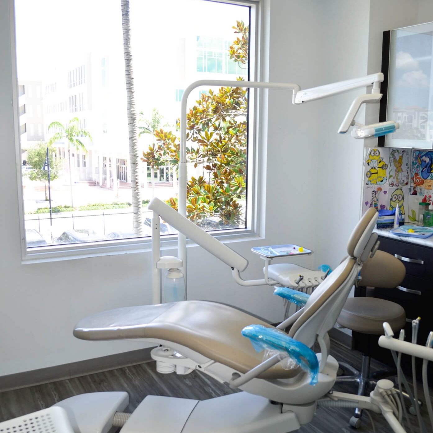 A picture of a dental chair looking out at an open window